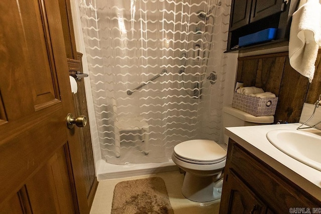bathroom featuring toilet, curtained shower, and vanity