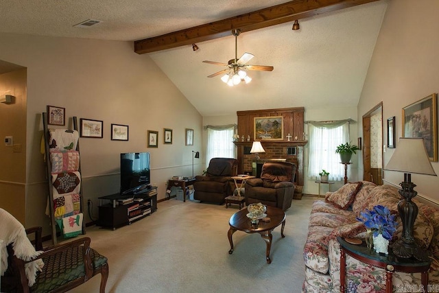 living area featuring ceiling fan, visible vents, light colored carpet, beam ceiling, and high vaulted ceiling