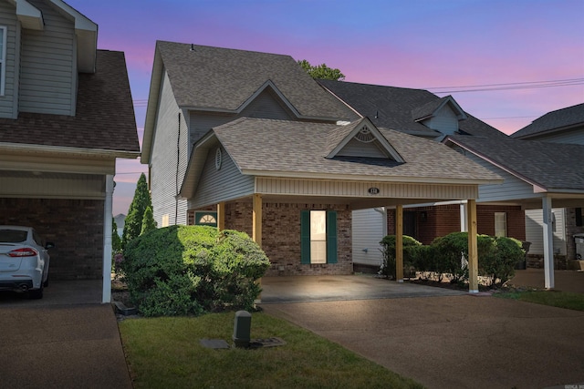 112 Lake Pointe Cv, Hot Springs, AR 71913 - view of front facade featuring concrete driveway, brick siding, and a shingled roof