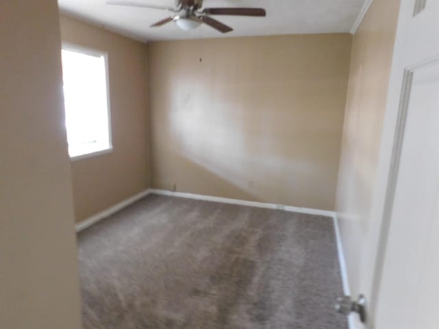 215 E 22nd St, Little Rock, AR 72206 - unfurnished room with baseboards, ceiling fan, and carpet