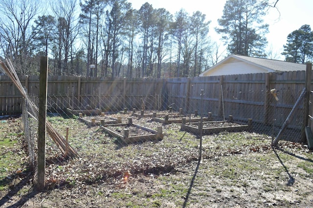 610 Reynolds Ave, White Hall, AR 71602 - fenced backyard with a vegetable garden