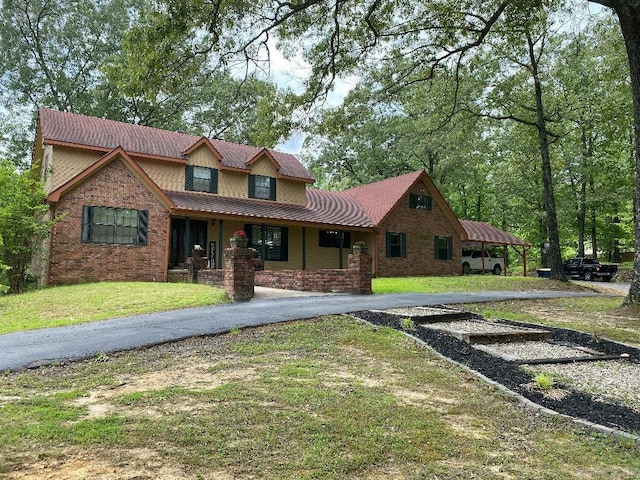 885 Mount Carmel Rd, Cabot, AR 72023 - view of front of home with covered porch, a front lawn, and driveway