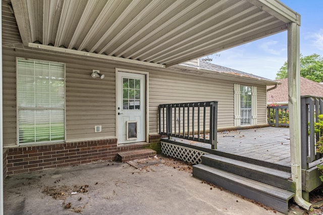 exterior space with brick siding and a wooden deck
