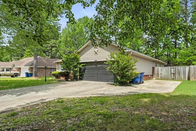 view of property exterior with a lawn, a garage, brick siding, fence, and concrete driveway