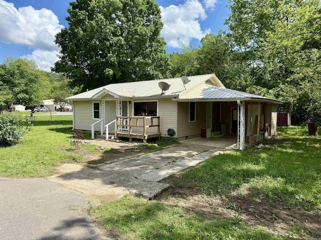 805 S St, Heber Springs, AR 72543 - view of front of house with an attached carport, crawl space, a front yard, concrete driveway, and metal roof