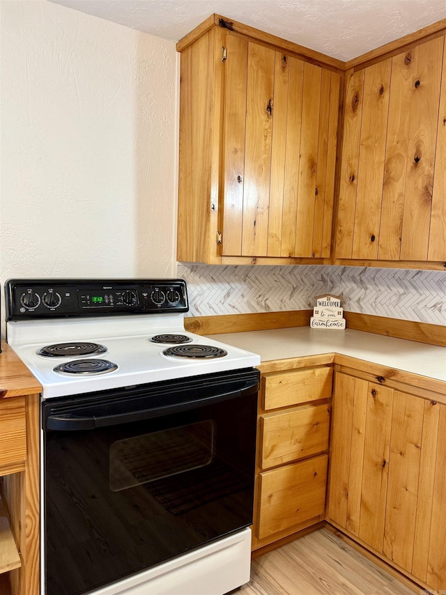 805 S St, Heber Springs, AR 72543 - kitchen featuring light countertops, range with electric cooktop, and light wood-style floors