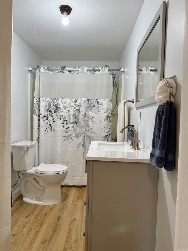 805 S St, Heber Springs, AR 72543 - bathroom featuring vanity, toilet, wood finished floors, and a shower with shower curtain