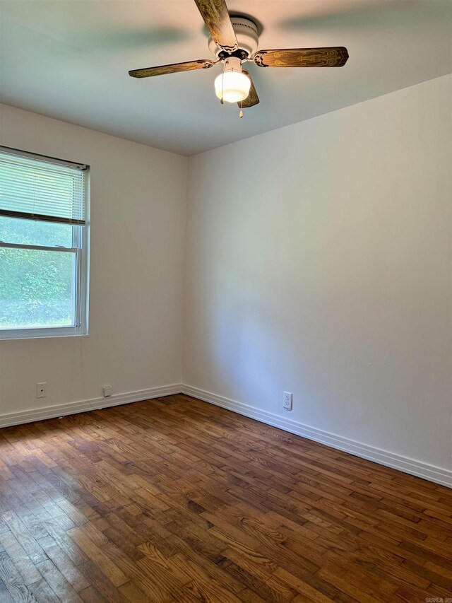 805 S St, Heber Springs, AR 72543 - unfurnished room with dark wood-style flooring, ceiling fan, and baseboards
