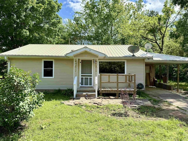 805 S St, Heber Springs, AR 72543 - view of front of home with driveway, metal roof, a front lawn, and an attached carport