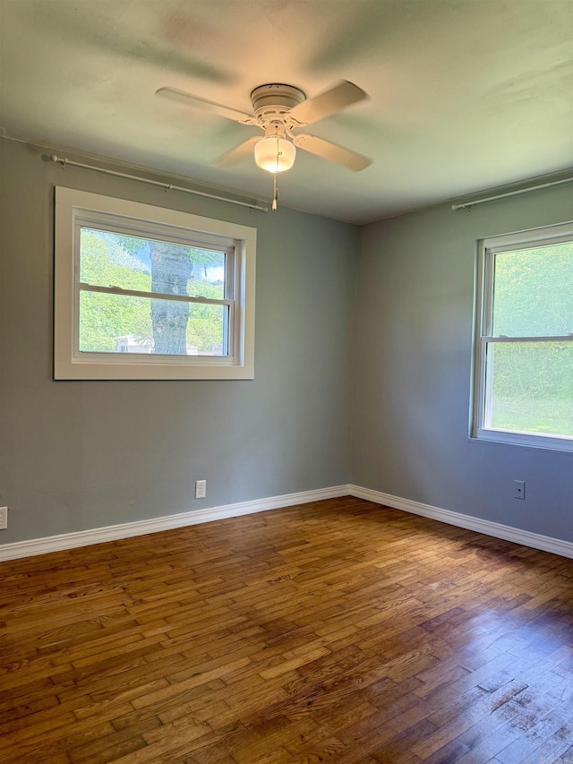 805 S St, Heber Springs, AR 72543 - spare room with baseboards, ceiling fan, and wood finished floors