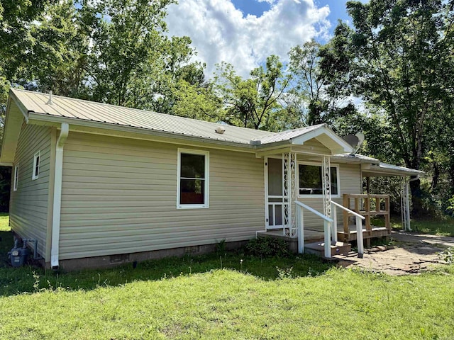 805 S St, Heber Springs, AR 72543 - view of front of house with crawl space, metal roof, and a front lawn
