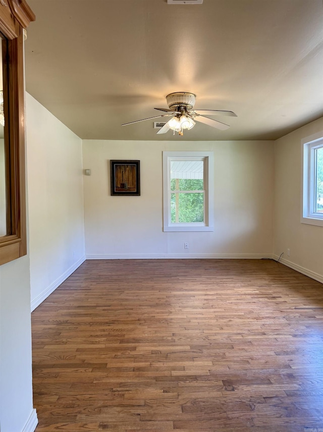 805 S St, Heber Springs, AR 72543 - unfurnished room with dark wood-type flooring, baseboards, and ceiling fan