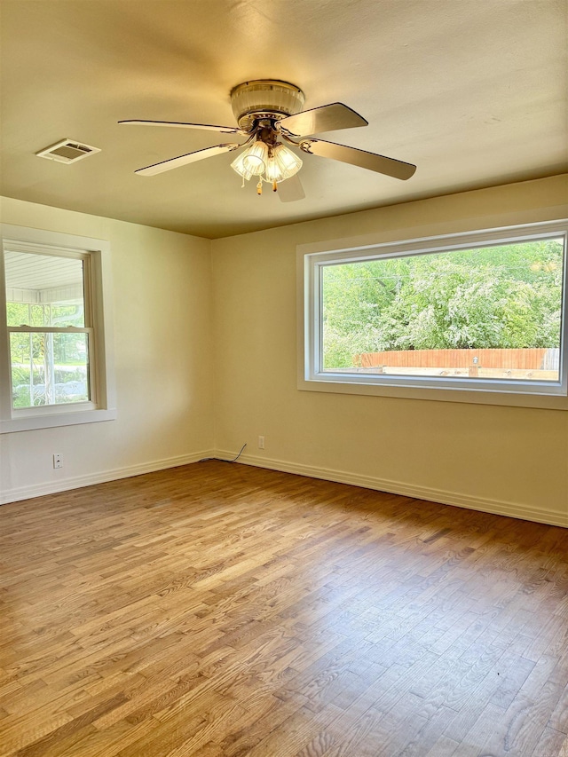 805 S St, Heber Springs, AR 72543 - unfurnished room with a ceiling fan, baseboards, visible vents, and wood finished floors