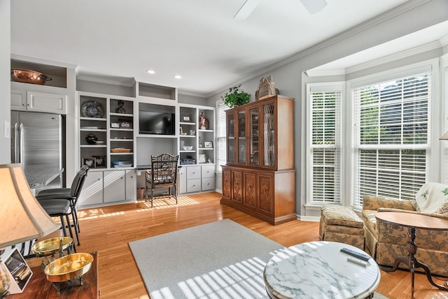 office space with crown molding, recessed lighting, light wood-style flooring, and a ceiling fan