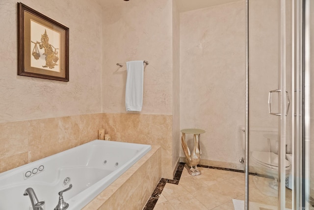 full bathroom with toilet and a jetted tub