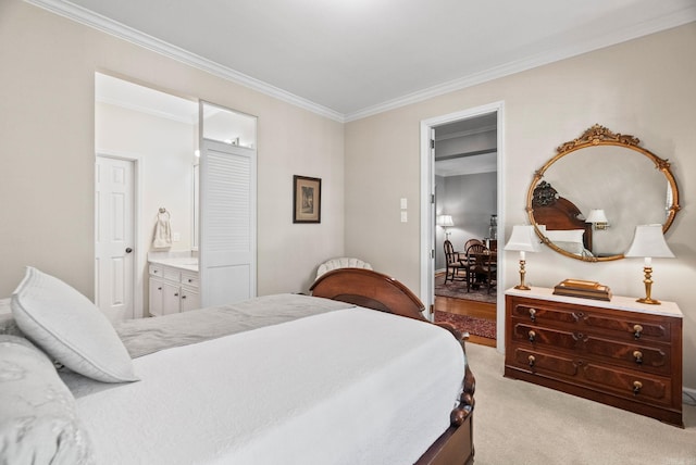 bedroom with crown molding, ensuite bath, and light colored carpet