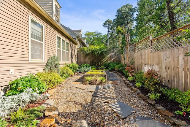 view of yard with a fenced backyard