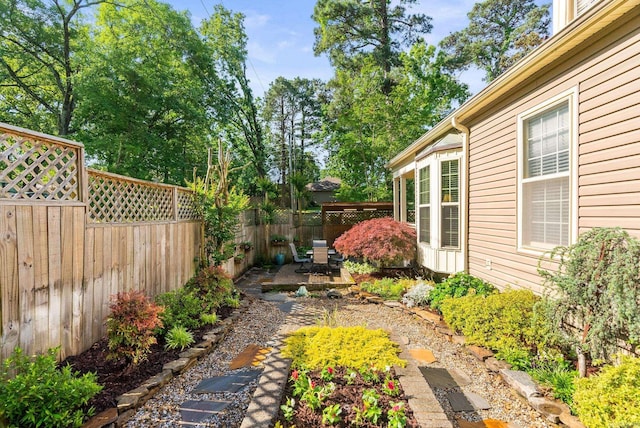 view of yard with a fenced backyard and a patio