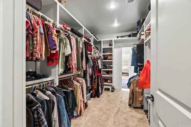 spacious closet with visible vents and carpet