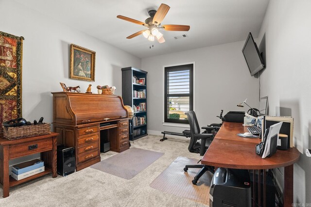 home office featuring ceiling fan, light colored carpet, and visible vents