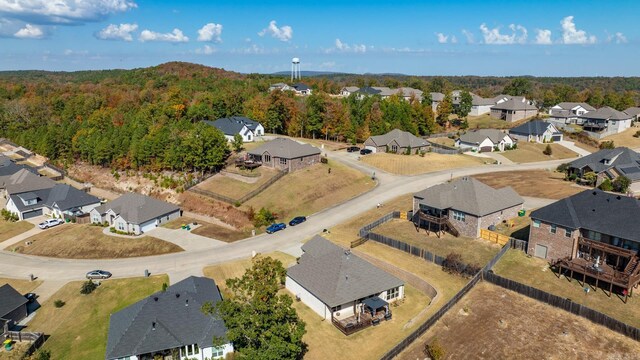 bird's eye view featuring a view of trees and a residential view