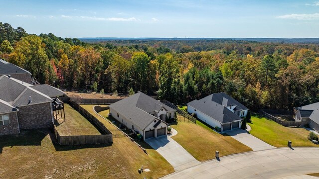 bird's eye view featuring a view of trees and a residential view