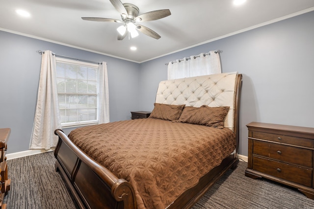 bedroom featuring dark carpet, baseboards, and crown molding