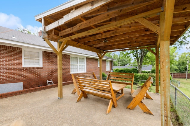 view of patio featuring fence