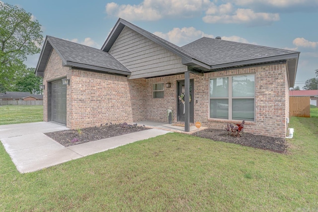 538 Maple St, Trumann, AR 72472 - single story home with a garage, a front lawn, brick siding, a shingled roof, and driveway