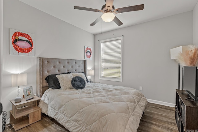 538 Maple St, Trumann, AR 72472 - bedroom featuring dark wood-type flooring, a ceiling fan, and baseboards