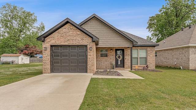 538 Maple St, Trumann, AR 72472 - view of front of house featuring brick siding, an attached garage, driveway, and a front yard