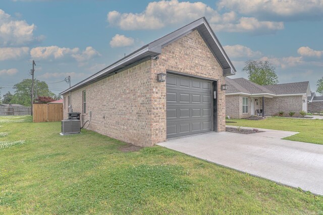 538 Maple St, Trumann, AR 72472 - view of property exterior with brick siding, fence, a yard, and concrete driveway