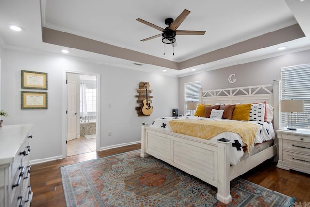 bedroom with crown molding, visible vents, dark wood-style floors, and a raised ceiling