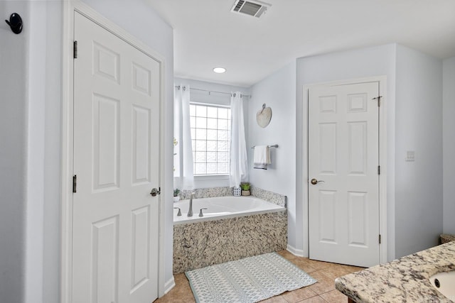bathroom with a garden tub, visible vents, tile patterned flooring, vanity, and recessed lighting
