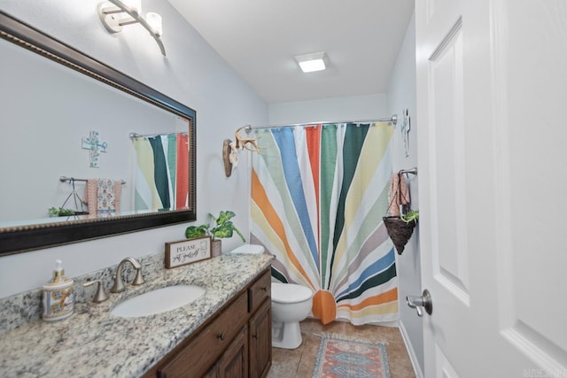 full bath featuring vanity, tile patterned flooring, toilet, and curtained shower