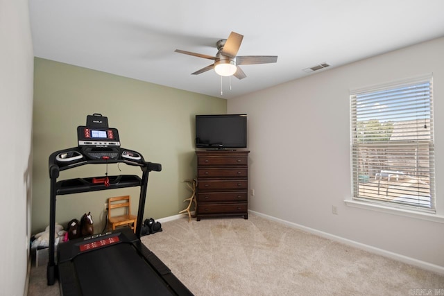 workout area featuring ceiling fan, visible vents, plenty of natural light, and carpet