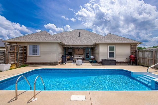 view of pool featuring fence, a fenced in pool, and a patio