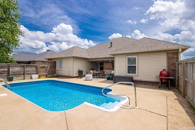 view of pool featuring a fenced in pool, a fenced backyard, and a patio area