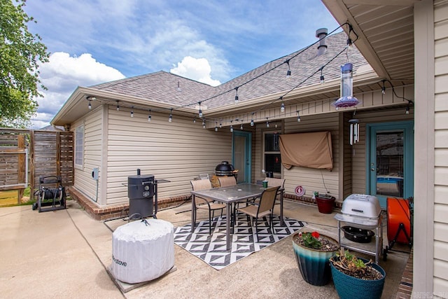 view of patio / terrace featuring fence and outdoor dining area