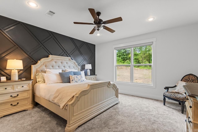 bedroom featuring light carpet, a ceiling fan, recessed lighting, and visible vents