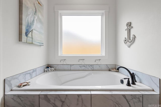 bathroom with a garden tub
