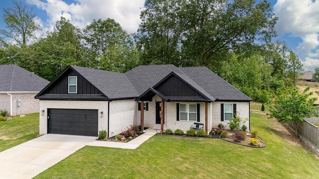 view of front of house featuring concrete driveway, a front lawn, and brick siding