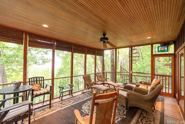 sunroom / solarium with a ceiling fan and outdoor lounge area