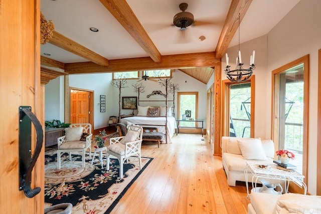 interior space with vaulted ceiling with beams, an inviting chandelier, and light wood-style flooring