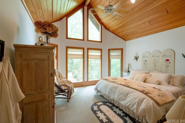 carpeted bedroom featuring high vaulted ceiling and wooden ceiling