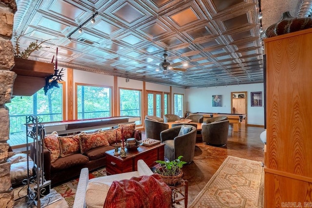 living room with an ornate ceiling and pool table