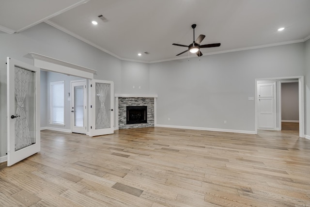 unfurnished living room with visible vents, ornamental molding, light wood finished floors, and ceiling fan