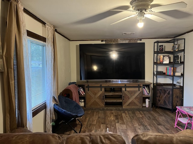 1008 Lange St, Leachville, AR 72438 - living room featuring ceiling fan, ornamental molding, wood finished floors, and visible vents