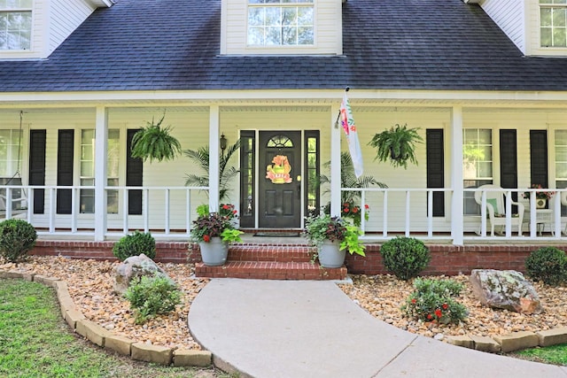 6311 Country Ln, Pine Bluff, AR 71603 - entrance to property with covered porch and a shingled roof