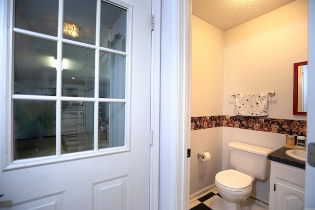 6311 Country Ln, Pine Bluff, AR 71603 - half bath with toilet, a textured ceiling, and vanity